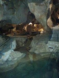 a cave with a staircase and water in it at Apartment Quintana Center Parking Gratis in Lucena