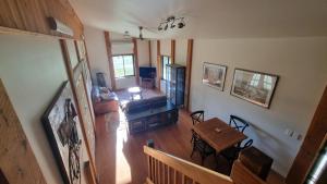 an overhead view of a living room with a table at The Stables - Farm Stay in Strath Creek