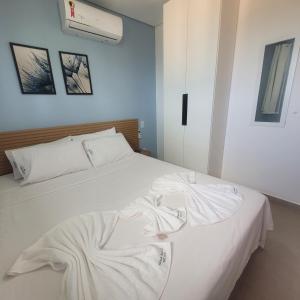 Giường trong phòng chung tại Maraca Beach 2 Residence-Flat a 70 m do mar