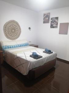 En eller flere senge i et værelse på Portonovo Great Ocean