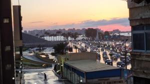 a busy city street with a lot of traffic at Alex Gate apartment - families only in Alexandria