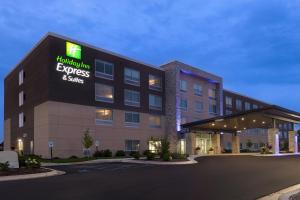 a hotel building with a sign that reads hotel rooms and suites at Holiday Inn Express & Suites - Brighton by IHG in Brighton