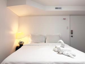 Кровать или кровати в номере Simple & Tidy Private Rooms