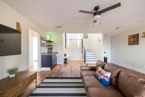 a living room with a couch and a ceiling fan at Heated Pool and Jacuzzi, Scenic Mountain View, Lux and Cozy, in Cottonwood
