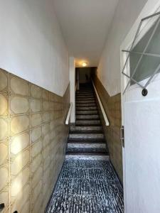 a staircase in a building with ailed floor at Magnolia II Departamento Céntrico in San Fernando del Valle de Catamarca