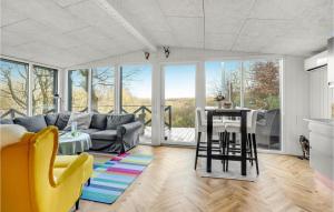 a living room with a couch and a table at Gorgeous Home In Gistrup With Sauna in Gistrup