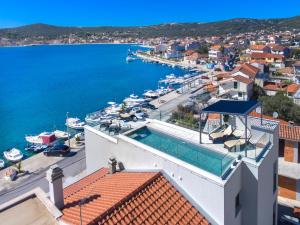 a view of the water from a building with a swimming pool at Villa Lux in Vinišće