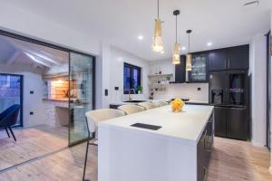 a kitchen and living room with a white counter top at Villa Lux in Vinišće +69 photos