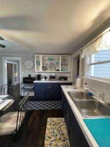 a kitchen with a sink and a counter top at River House in South Williamsport