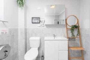 a white bathroom with a toilet and a sink at 1 Private Double Room in Berala near Station close to Olympic Park in Regents Park
