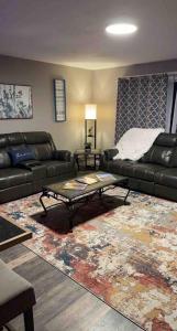 a living room with a couch and a coffee table at Spacious 3 BD Close To Everything! You’ll Love It! in Anchorage
