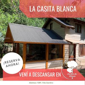 a poster of a house with a sign that says la casita at Complejo Jardín De Los Olmos in Villa Giardino