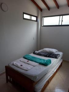 Postel nebo postele na pokoji v ubytování Apartamentos con estacionamiento cerca al parque