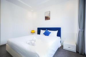 Postel nebo postele na pokoji v ubytování Rose Hotel Phú Quốc