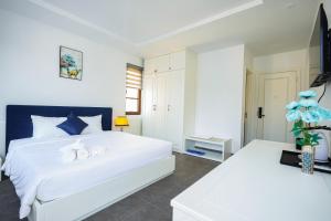 Postel nebo postele na pokoji v ubytování Rose Hotel Phú Quốc