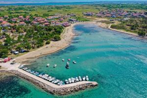 an aerial view of a beach with boats in the water at Apartment Luka in Privlaka