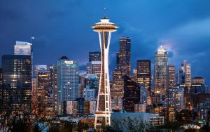 a city skyline with the space needle at night at Studio Apartment with Shared Bathroom 10 minutes walk to University of WA in Seattle