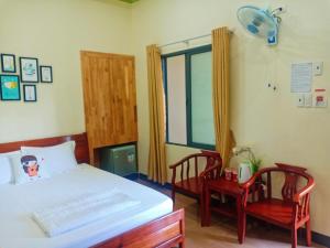 Postel nebo postele na pokoji v ubytování Đức Chính Hotel - Ninh Chu - Phan Rang