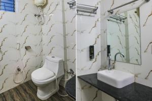 Een badkamer bij FabHotel Vinayaka