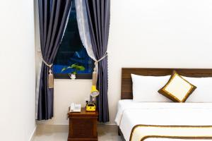 Voodi või voodid majutusasutuse Đà Lạt Cao Nguyên Hotel toas