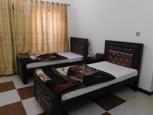 Giường trong phòng chung tại Usmania Guest House