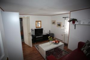 TV a/nebo společenská místnost v ubytování Gasthof Auerhahn