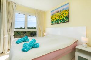 Postel nebo postele na pokoji v ubytování Top Strandwohnung Marina Park