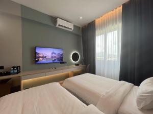 Postel nebo postele na pokoji v ubytování FUHOTEL