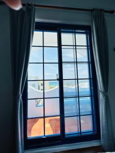 Fotografie z fotogalerie ubytování 海灘戀情 Beach Love 近沙灘-國旅卡特約商店 陽台房 希臘地中海風格 v destinaci Eluan