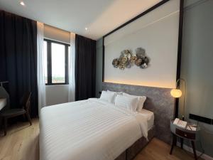 Postel nebo postele na pokoji v ubytování FUHOTEL