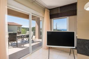 A television and/or entertainment centre at Charilena's luxury apartment
