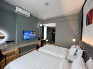 Postel nebo postele na pokoji v ubytování FUHOTEL