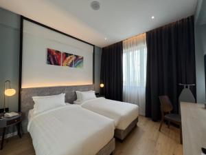 Postel nebo postele na pokoji v ubytování FUHOTEL