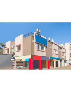 a rendering of a building with colorfulfacades at Hotel Atit Villa, Ujjain in Ujjain