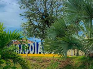 a sign that says volvo behind some palm trees at Casa temporada Araçoiaba in Araçoiaba