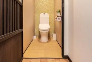 a bathroom with a toilet in a hallway at Kyoto-Toji house in Kyoto