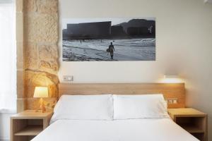 Postel nebo postele na pokoji v ubytování Welcome Gros Hotel