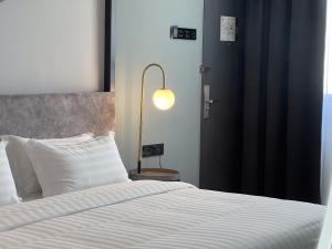 Postel nebo postele na pokoji v ubytování FUHOTEL