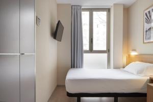 Postel nebo postele na pokoji v ubytování Welcome Gros Hotel