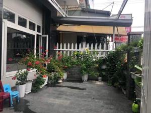 a patio with potted plants in front of a building at Motel Minh Thảo in Da Nang