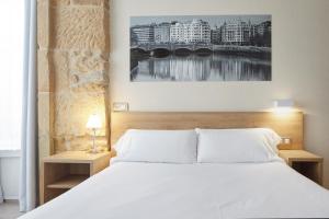 Postel nebo postele na pokoji v ubytování Welcome Gros Hotel
