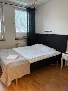 Postel nebo postele na pokoji v ubytování Drottninggatans Vandrarhem