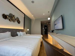 Postel nebo postele na pokoji v ubytování FUHOTEL