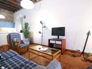A television and/or entertainment centre at Loft Algavira
