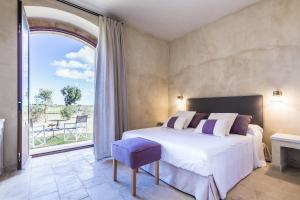 a bedroom with a bed and a large window at Casa Vendicari Boutique Hotel in Noto +95 photos