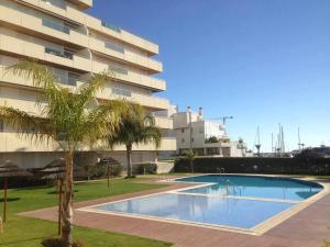 a large swimming pool in front of a building at Marina Vilamoura Aquamar 120 By Vilamoura Sun in Vilamoura