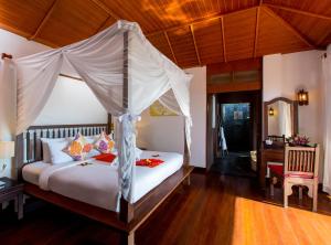 Rúm í herbergi á Elixir Resort Koh Yao Yai - SHA Plus