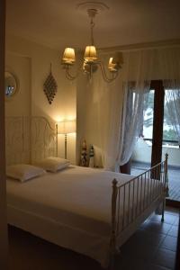 A bed or beds in a room at Villa Musa with private pool