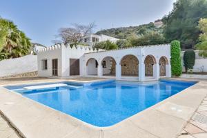 a swimming pool in the backyard of a villa at BAHÍA DE EL PORTET - By Almarina Villas in Moraira