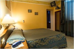 Postel nebo postele na pokoji v ubytování B&B Degli Amici